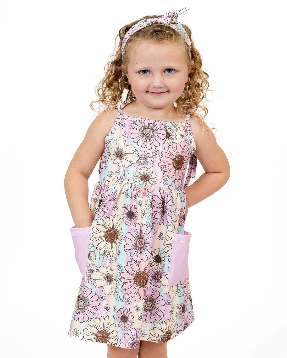 This Summer Floral Sleeveless A-line Dress is perfect for adding a few pops of color to your closet! With a beautiful pastel print, square neckline, tie knot straps, and pockets (what?!), you'll stay comfy AND stylish in this show-stopping A-Line cut. Now you can look good and keep your goodies safe!