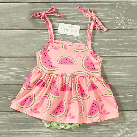 Let your little one have a sweet day of picnicking in the Watermelon Picnic Girl's Infant Romper! With its spaghetti-strap top featuring a delicious watermelon print, and accent skirt and attached adorable green check print bottoms, it’s the perfect pick for a summer day. The best part? Snap up design for quick n' easy changing! Yum!