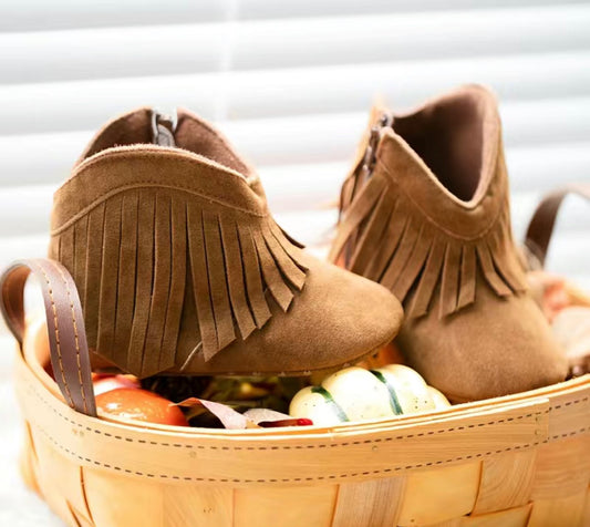 These oh-so-adorable baby moccasin boots are the perfect way to kick off your cutie's shoe collection! Super-soft soles keep tiny toes warm and comfy, while the anti-slip design lets moms and dads breathe a sigh of relief. Perfectly paired with tassles and fringe, these little booties will have 'em stepping out in style! Great for boys and girls!