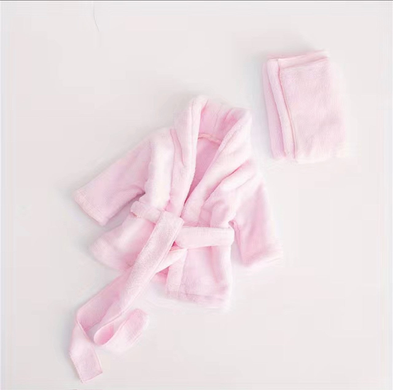 This adorable pink bathrobe and headwrap are perfect for dressing up your tiny one! So sweet and so soft! Bath time has never looked so adorable! Wrap them up in this cozy combo for some maximum comfort! Perfect for a spa baby photo shoot.