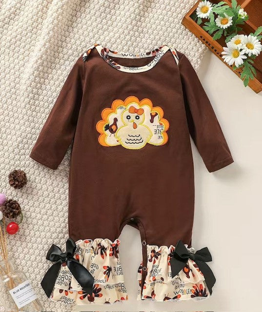 Let your little one strut their stuff in this oh-so-adorable Gobble Gobble Girls Turkey Romper! Featuring a cute turkey applique and a double ruffle hem with a gobble gobble print fabric, finished off with a satin bow at the ankle - your little one's style will be soaring higher than a turkey's wings! Get ready for a gobble-riffic day!