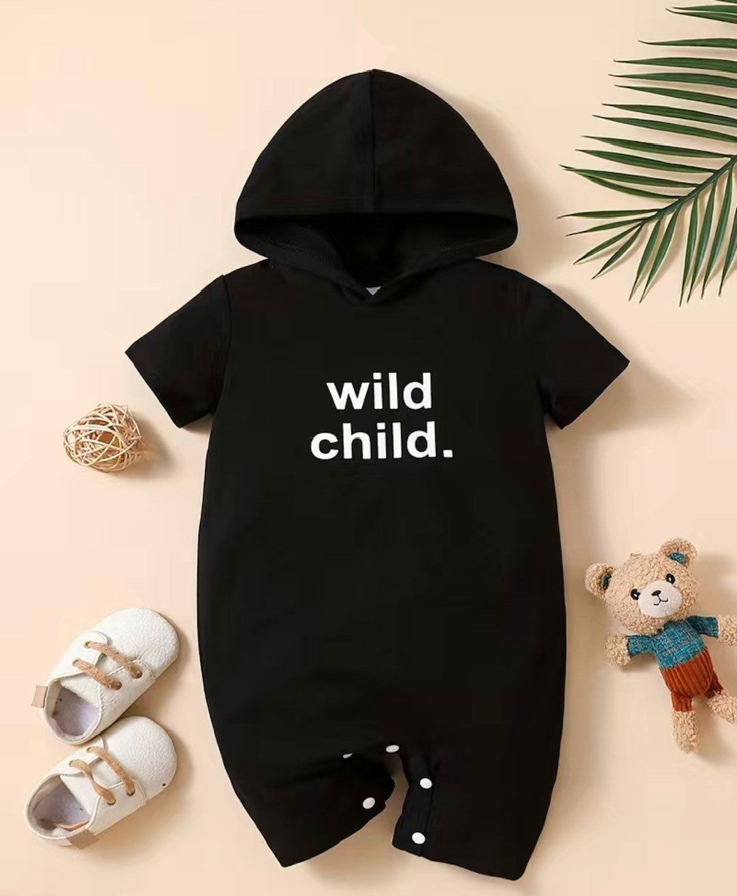 Live your wildest dreams with this stylish Wild Child romper! With its classic black hue, short sleeves, short pants and stylish hood, you'll look effortlessly cool - plus you'll be comfy enough for all your crazy adventures! It even features a snap bottom for easy changing, so you can keep on rompin'!