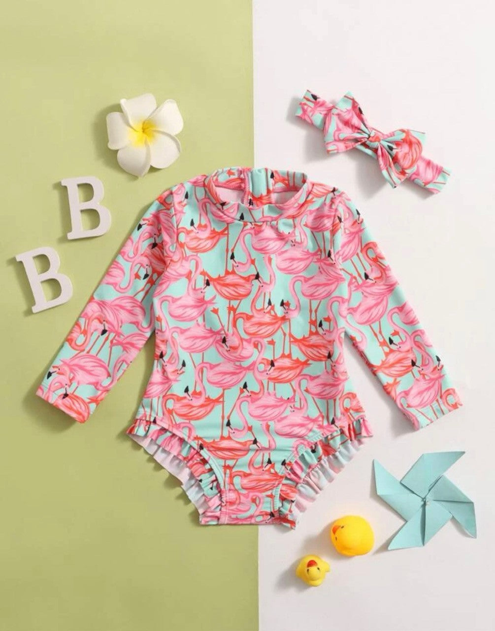 Dive into the pool in style with this Flamingo's Forever swimsuit and Headband. Perfectly protect your little one from the sun's rays with the SPF 50 fabric, and let the ruffled leg and flamingo print totally wow everyone around. Complete the look with the adorable matching headband with bow and make a splash in style! Let's go get sun-sational!