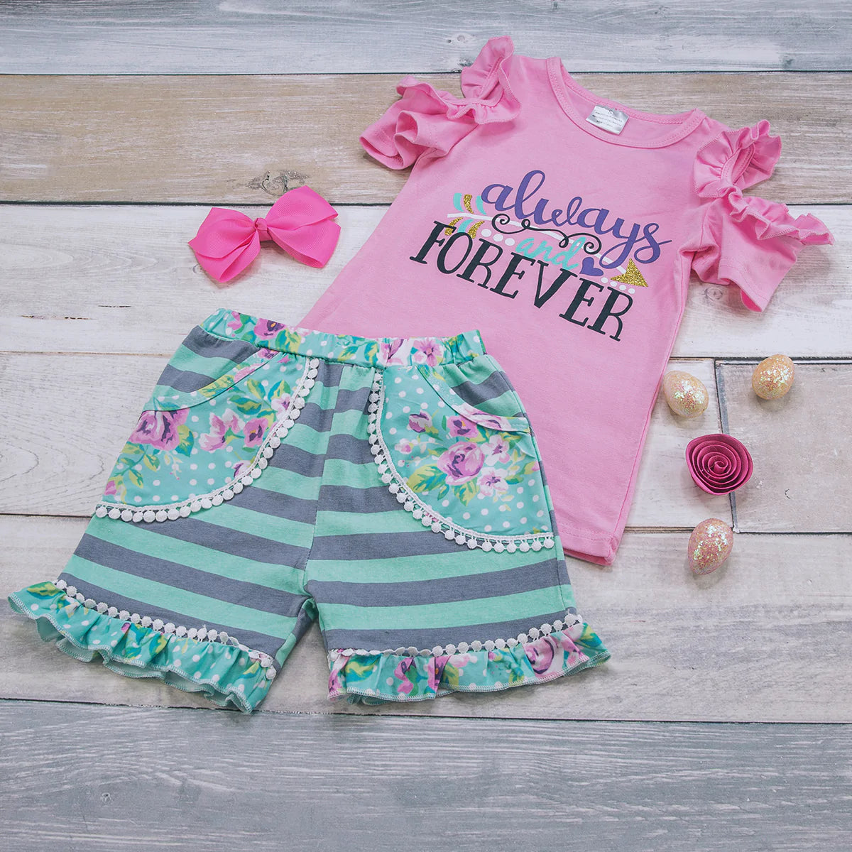 Southern Sweet- Always and Forever short set. Cold shoulder ruffle sleeve top, elastic waist 2 pocket shorts with leg ruffle. So sweet we could just eat you up!!