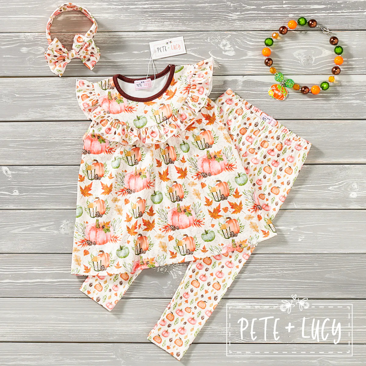 Make your autumnal dreams come true with this Pumpkin Spice Ruffled short sleeve pant set! We're in love with the mix of pun'kin prints that make it a must-have for the season. The flutter sleeves and ruffle chest add a hint of sweetness-perfect for Fall. Ready, set, spice up your wardrobe! 👻