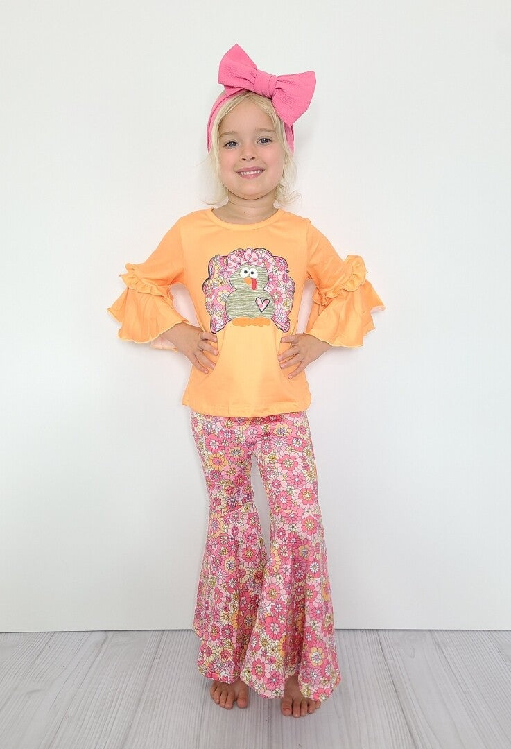 This pant set is absolutely precious! The combination of the adorable floral print bell pant and the cute turkey print on the adorable ruffle sleeve top is on point! Can't wait to see our best dressed girls in this ensemble for Thanksgiving.