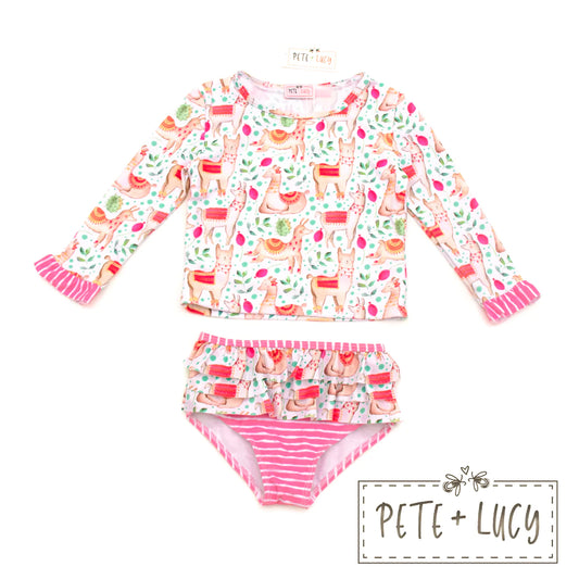 This Sweet Llamas 2 Piece Swimsuit will have your friends saying “alpaca-my-bags”! Featuring a long-sleeved ruffle top and bottoms in an adorable llama print, this ensemble is sure to keep you protected from both sunburns and fashion-faux-pas! 🤩