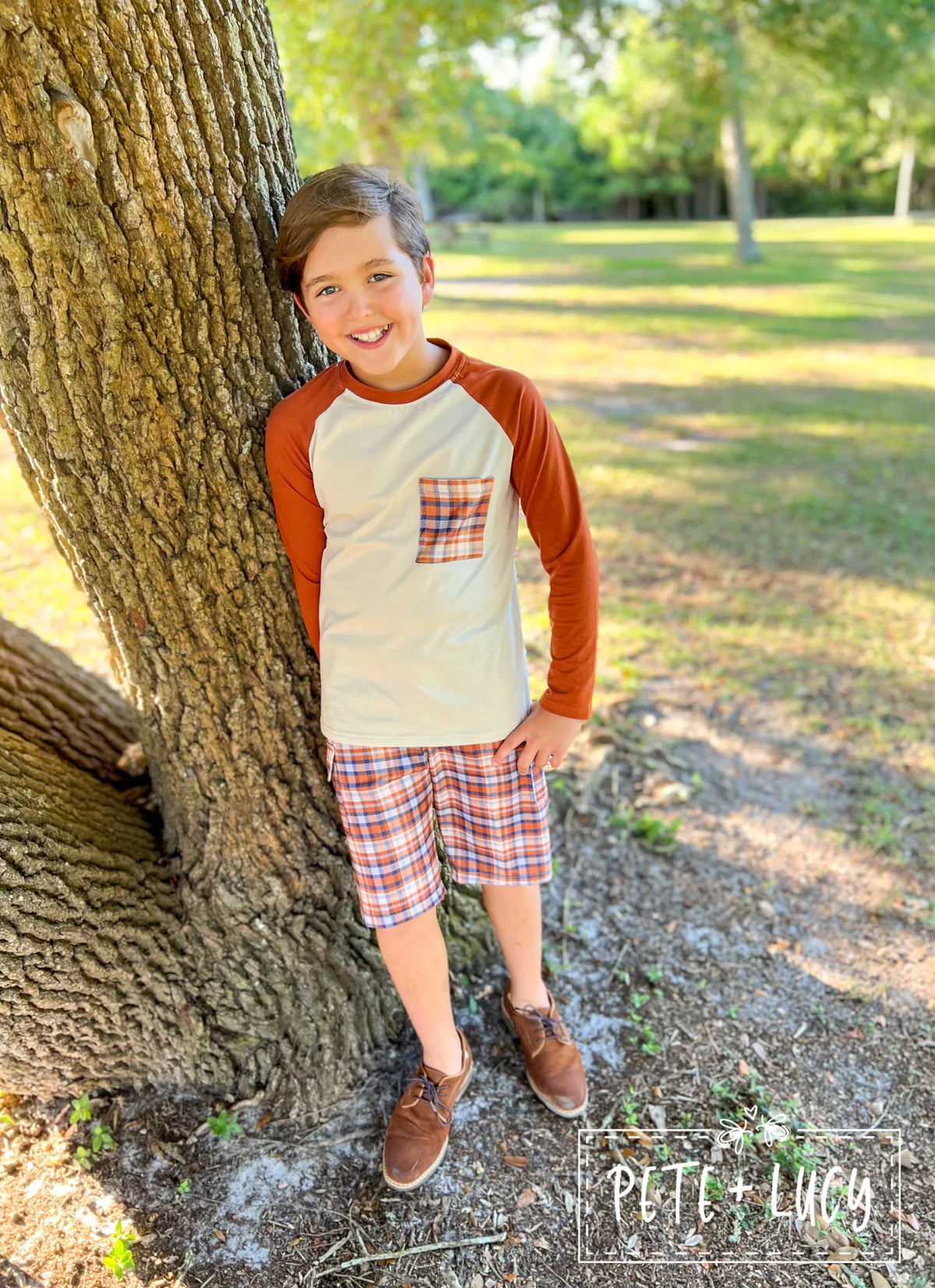 How handsome your little guy will look in this adorable 2 piece long sleeve short set. We love the plaid pocket on the shirt with the matching shorts, too cute! The shorts have an elastic waist and a side flap top pocket on the leg. Great for just about anything!!