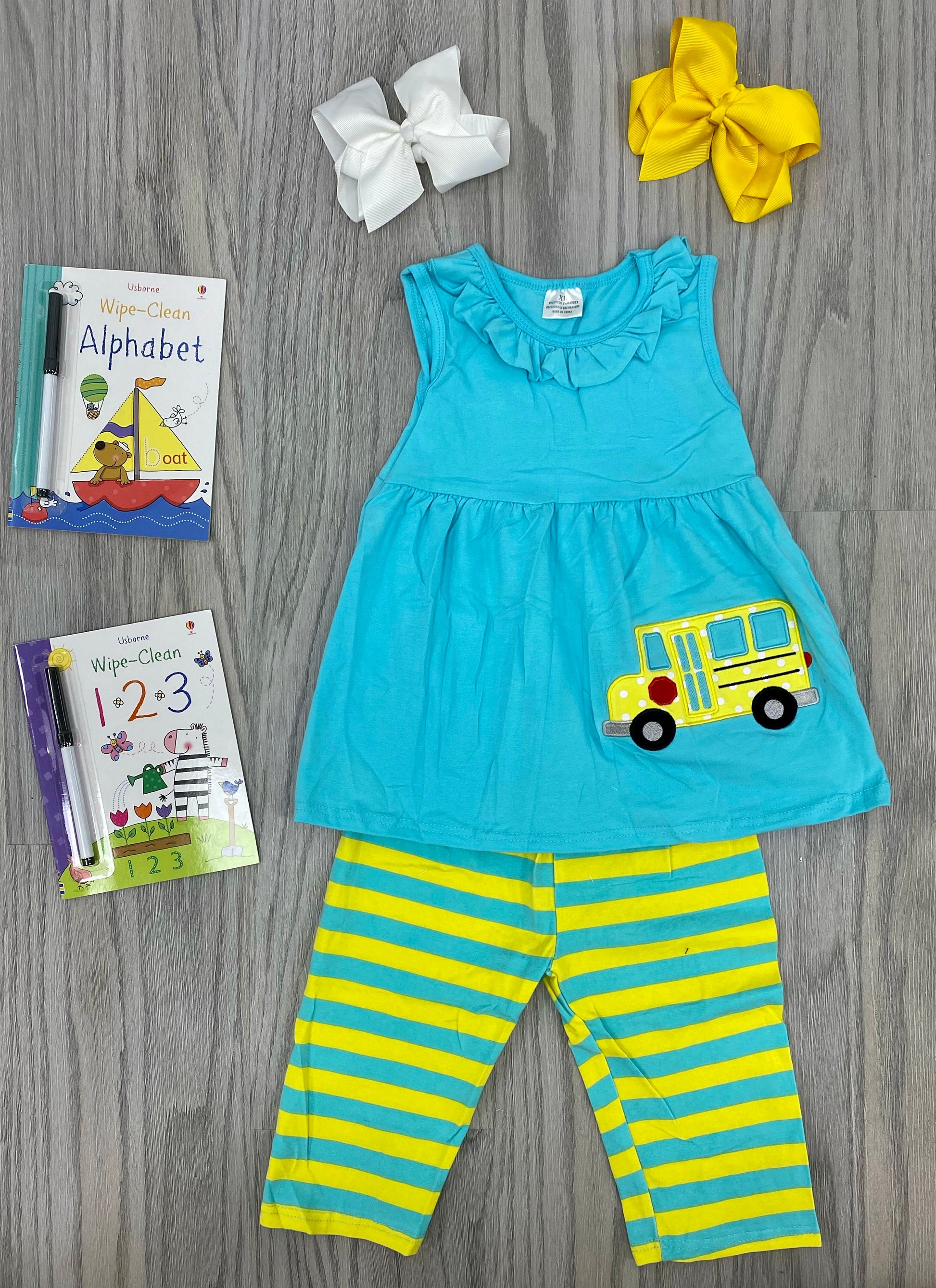 Back to school has never looked better. This adorable 2 piece striped pant, ruffled neck sleeveless look is perfect for the season. Pair it with a super cute hair bow or a great book for an awesome gift!