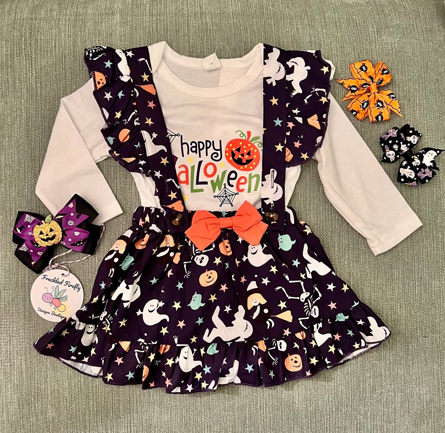 This absolutely Boo-tiful 2 piece Halloween print ruffle dress is so on point for this season. The ghost design on the dress with the added orange bow is too cute! The printed ruffle shoulder, snap bottom onesie can be worn separately. check out our adorable Halloween inspired hair accessories to add on to this adorable dress!