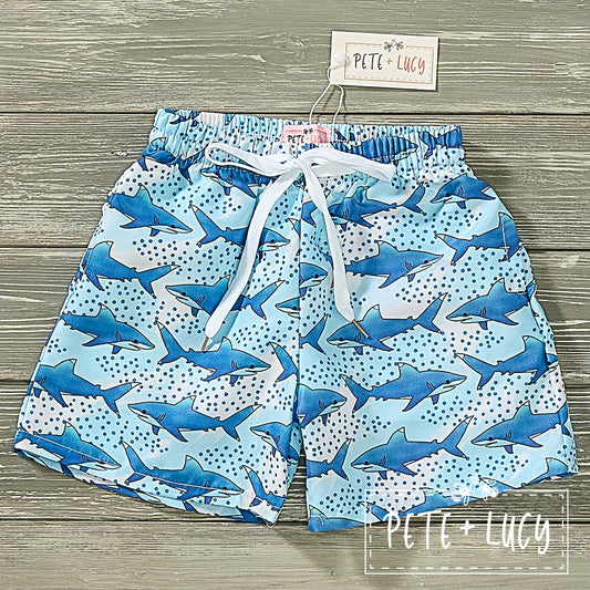 Let your little one swim with the sharks in style with these Shark Frenzy Boy's Swim Trunks! Constructed with a garterized waistband and drawstring, these lined swim shorts will keep them secure and comfy while they're at play in the sea. Also equipped with UPF 50 sun protection. A must this spring/summer!