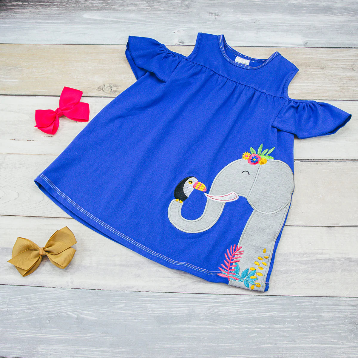 Adorable Ellie and friend royal blue cold shoulder dress. What a sweet addition to any little girl's wardrobe! Pair it with leggings to change up the look. 