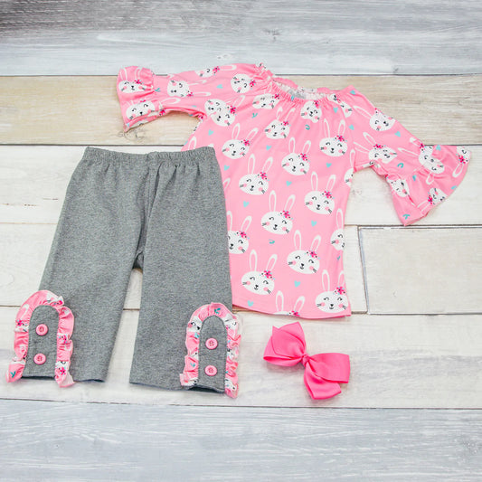Hop to it and add this adorable pant set to your cart. The milk silk bunny print top w/ ruffle sleeve is the perfect match to the gray pants with the matching ruffle trim on the leg. The pink buttons were the perfect addition to finish off the look. 
