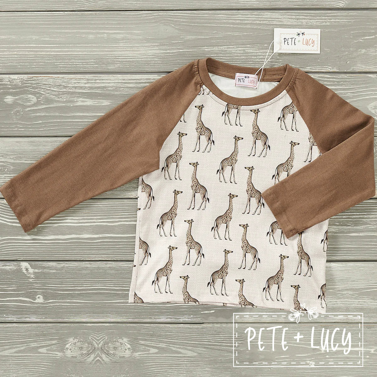 This Tall as a Giraffe Long Sleeve Shirt is crafted with exceptional detail. Featuring a stylish giraffe pattern against a solid color sleeve and round neck, this design ensures a comfortable fit and optimal breath-ability. Achieve a chic, stylish look paired with any casual outfit!