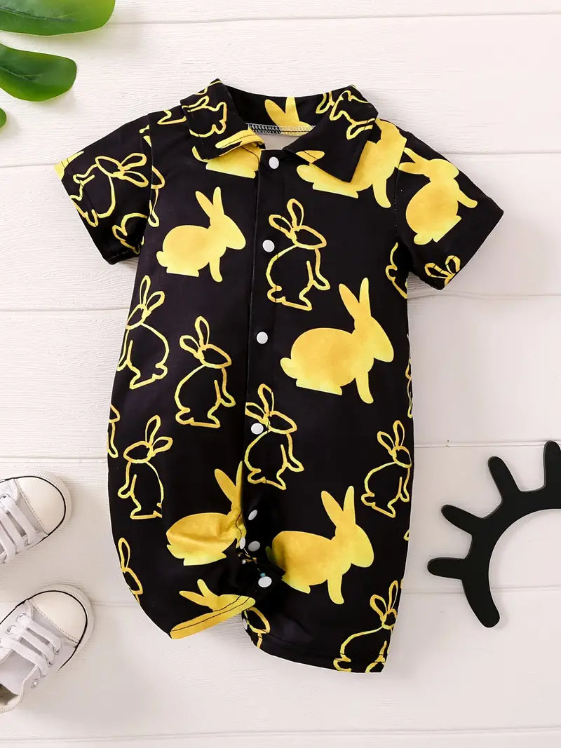 How adorable your little one will be in this black short romper with golden bunny print. Super cute with tailored collar, short sleeve and snap front and crotch. 