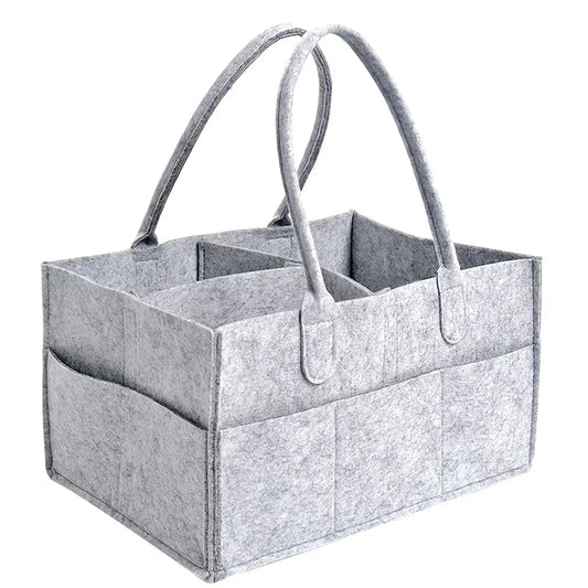 Go beyond the basics with this modern take on diaper organization! Our Felt Diaper Caddy is crafted with high-quality felt for superior durability, plus 8 outer pockets for maximum storage and customizable inserts for flexible organization. Handcut edges keep the caddy neat and in place, so you can diaper in style!
