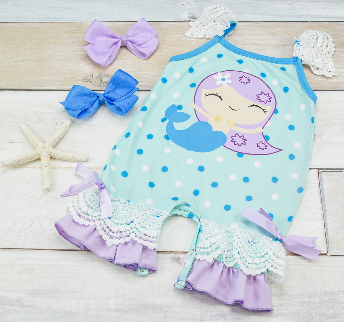 I must be dreaming! This fantastical mermaid inspired romper is magical, with the double ruffle leg and lace accents this is a must for your sweet little mermaid!