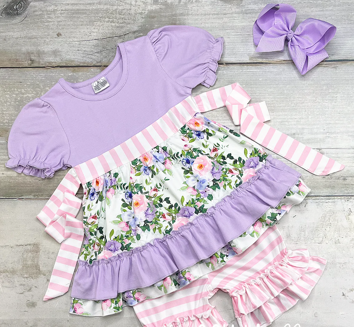 Oh so sweet-the lilac and floral print top could not be cuter and the double ruffle striped short and the matching back tie-bow complete the set. Your little beauty will be all the rage this season in this versatile outfit!
