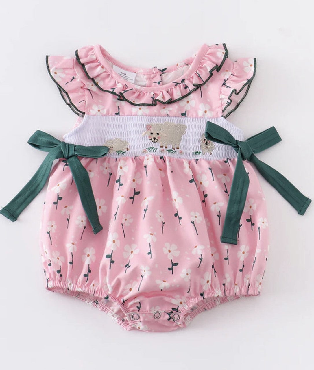 Introducing this adorable Bubble Romper - perfect for your little one's wardrobe! This sweet romper features an eye-catching pink floral design, plus flocking with a precious sheep design that's sure to cause a few oohs and aahs! It features a ruffled neckline and sleeve and snap bottom for easy dressing. Plus, with its great design, your little one will look sweet as sheep! Baaaaby clothes never looked this good!