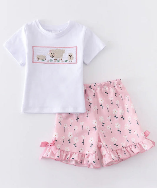 This 2-piece pink floral and lamb set is perfect for the little fashionista in the making! With a fun floral print short and sweet smocking shirt with a lamb design she'll look oh-so-cute and comfortable in this outfit. Ruffled trim adds an extra touch of cuteness! Get ready to gush!