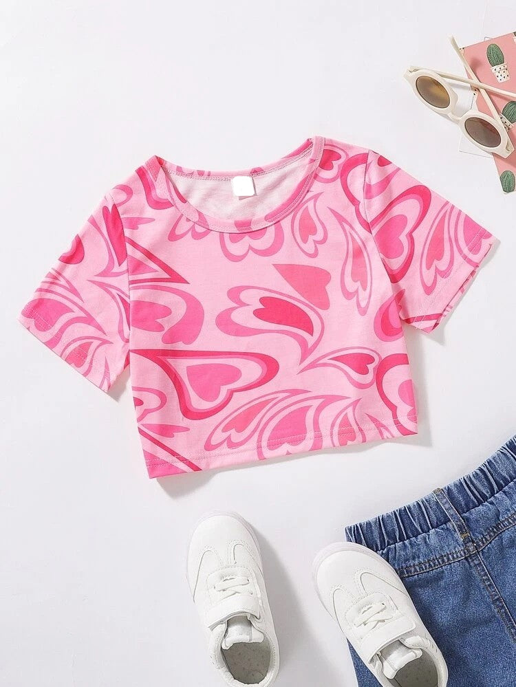 Your little heart breaker will definitely melt a few hearts wearing this pink on pink short sleeve crop top. Pair it with shorts, a skirt, jeans or slacks to change the look. A definite must for your little love's wardrobe this season.