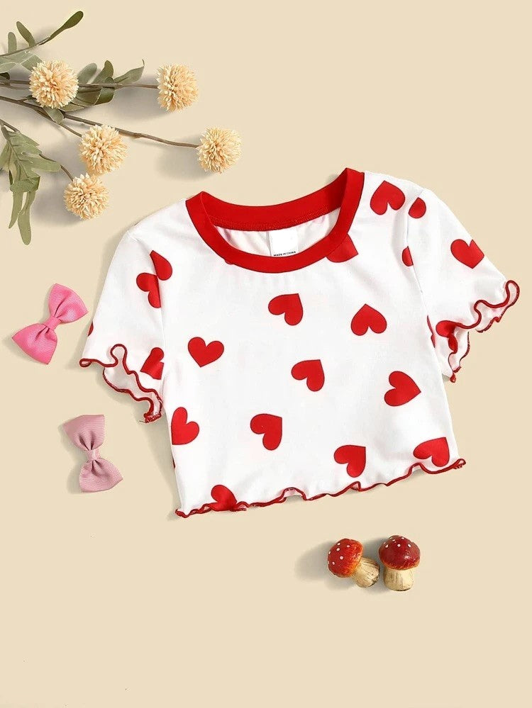 This adorable heart pattern crop top has a cap sleeve, rounded neck with lettuce trim contrast binding. Pair it with jeans, a skirt, shorts etc... Your little love will be on point with this adorable top!