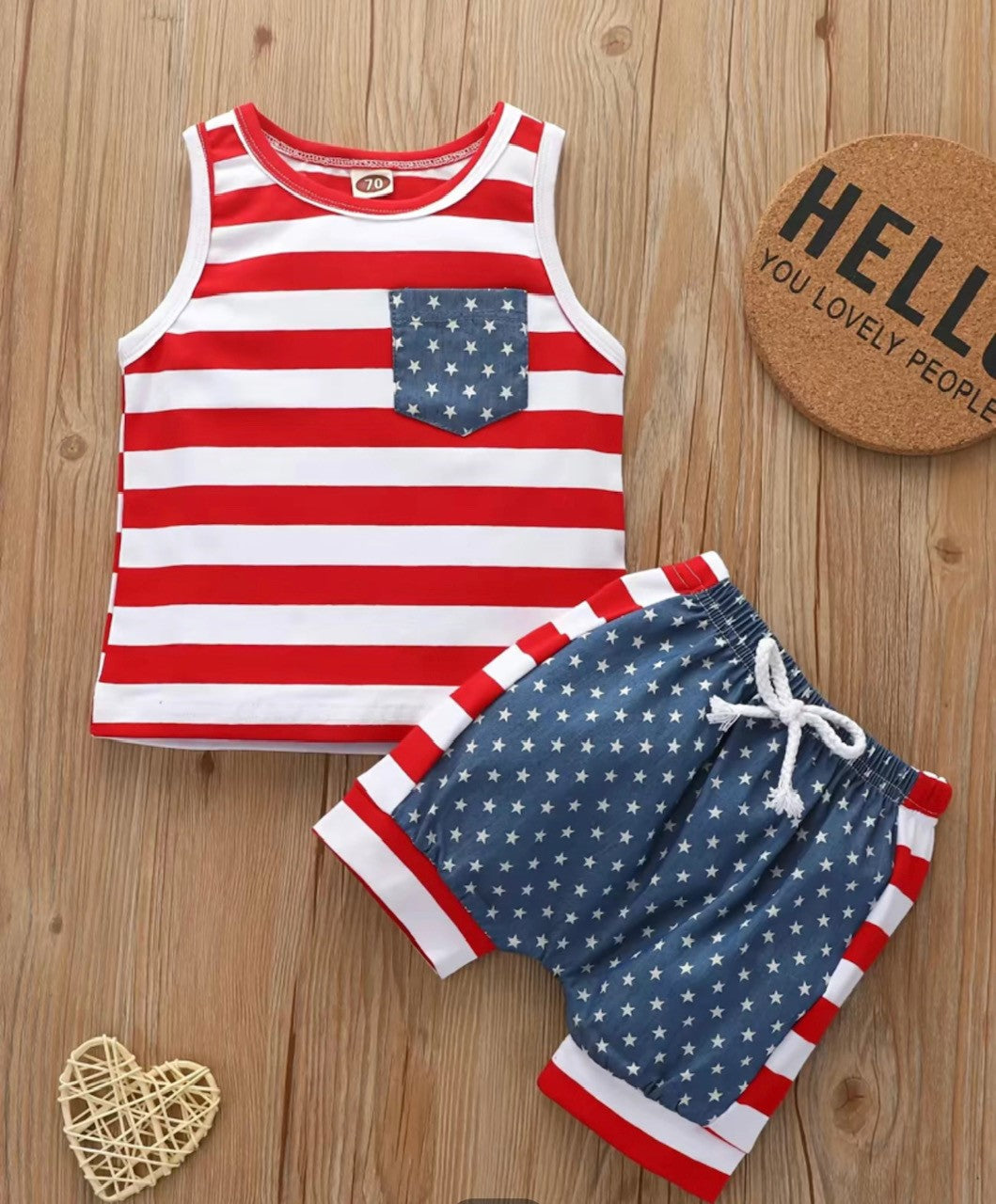 Show your colorful, patriotic side with this delightful 2-piece set! Featuring a red and white striped tank top with an adorable blue-star pocket. Matching plus elastic waist shorts with an adjustable drawstring - you'll look stars and stripes above the rest! Make a statement in this adorable and comfortable outfit!